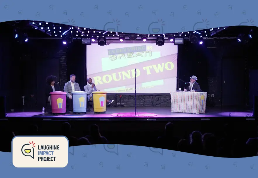 this is an image of comedian/improviser/theatre makers, Eunice Elliott, Rich Mansfield, Christopher Davis, and Matt Davis performing at the debut of Everything is Great town hall comedy show event produced by Laughing Impact.